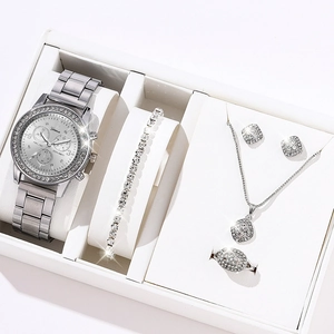 Close-up of a silver jewelry set with quartz watch, necklace, and ring in a gift box