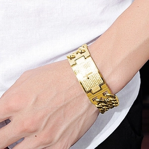 Close-up of gold stainless steel chunky chain bracelet with engraved cross and scripture