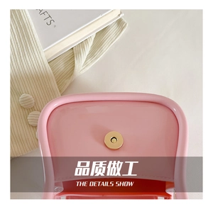 Close-up of the round gold magnetic snap closure inside the pink macaron jelly bag