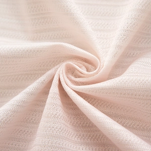 Close-up of light pink breathable woven fabric with fine texture for Christmas curtains