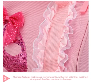 Detail of pink ballet bag featuring lace trim, polka dot bow, and sequined embroidery