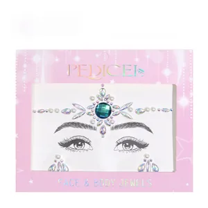 Detailed view of green crystal face and body jewels for bohemian party makeup looks
