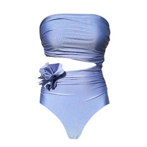 Detail of 3D flower embellishment and cutout design on shiny metallic monokini