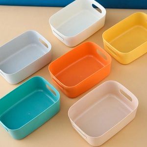 Multi-colored plastic organizer boxes with hollow side handles for home storage