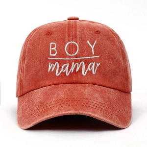 Close-up of BOY mama white embroidery on distressed washed cotton baseball cap