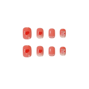 Pink gradient press-on nails featuring red heart patterns and 3D bear ornaments
