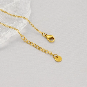 Detail of gold-plated butterfly bracelet featuring adjustable extension chain and lobster clasp