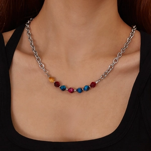 Fashionable stainless steel chain necklace with colorful faceted natural stones on model