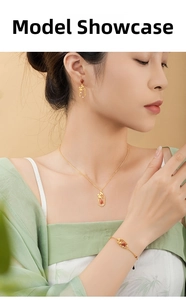 Detail of S925 silver necklace set with red agate teardrop pendant on female model