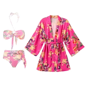 Three-piece floral bikini set with tie-front halter top and matching long sleeve cover-up