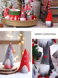 Detail of knit Christmas gnomes with red and grey hats in a festive scene decoration