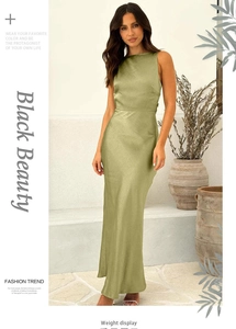 Detail of elegant olive green satin maxi dress showing the glossy fabric and smooth texture