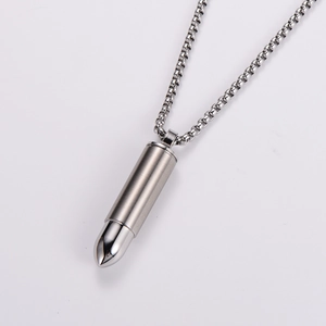 Detailed view of silver stainless steel bullet pendant necklace with a box chain