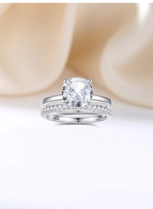 Close-up of S925 silver bridal ring set featuring a 2ct sparkling round diamond solitaire