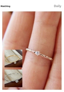Macro detail of textured gold and silver rings with sparkling cubic zirconia accents