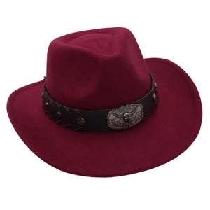 Detailed macro view of the silver bull head emblem and metal star studs on hat