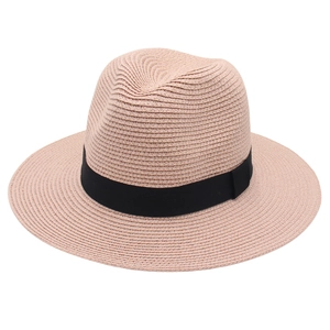 Detailed view of the woven texture and black ribbon on the pink Panama fedora hat
