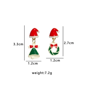 Detailed view of asymmetric Christmas earrings showing size dimensions and festive ornaments