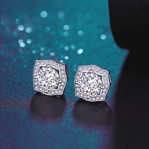 Macro shot of 925 sterling silver D color moissanite stud earrings with halo setting