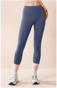Close-up of high-waisted fog blue yoga leggings with seamless stitching and soft fleece lining