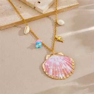 Detail of gold starfish necklace with pink gradient shell pendant and sea dolphin charm
