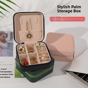 Close-up of portable PU leather jewelry box showing necklace hooks and ring slots