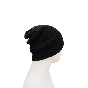 Close-up of black ribbed knit beanie with vertical texture and slouchy winter style