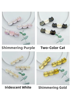 Detail view of acetate cat hair clips in purple, black-white, pearly white and gold