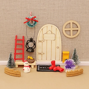 Miniature Christmas dollhouse set with wooden door wreath and festive holiday accessories