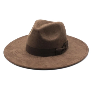 Detailed close-up of dark brown fedora hat showing wool felt texture and ribbon bow