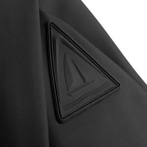 Macro view of water-resistant black fabric texture and triangle logo on chest bag