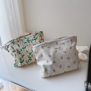 Floral cotton makeup bags with zipper closure in green and pink botanical patterns