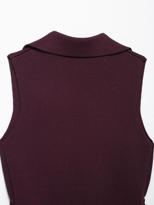 Detail of the knit texture and back collar design on a sleeveless burgundy top