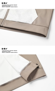 Detail von Colorblock-Hoodie mit Reißverschluss, khakifarbener Struktur und Rippbündchen