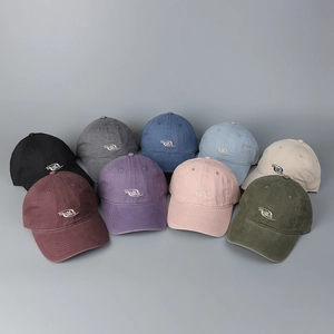 Macro shot showing diverse colors and collaborate embroidery on cotton baseball caps