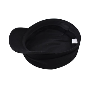 Detailed internal view of black cotton newsboy cap showing wash care label and stitching