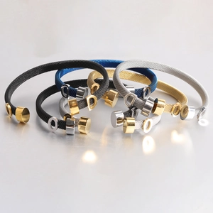 Close-up of flexible 6mm mesh cable bracelets in gold, blue, black and silver finish