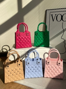 Group of colorful EVA beach bags with diamond lattice pattern and cutout holes