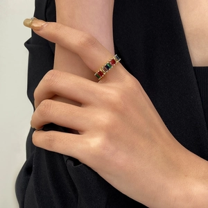 Elegant gold open ring featuring rainbow rectangular zircons on a model's hand