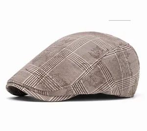 Detail of coffee brown plaid ivy cap featuring a vintage maple leaf pattern design