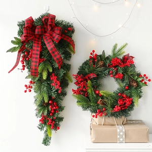 Christmas wreath and swag set with pine needles, red berries, and plaid ribbons