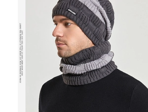 Close-up of thick ribbed knit texture on gray striped beanie and neck warmer set