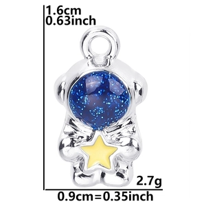Detail view of astronaut pendant with dimensions 1.6x0.9cm and blue glitter helmet finish