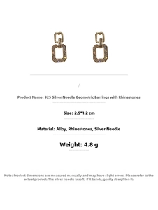 Detailed view of gold geometric drop earrings with 925 silver needles and sparkling crystals