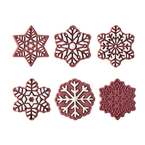Set of 6 snowflake-shaped Christmas cookies with detailed 3D white icing patterns on red
