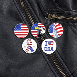 Detail shot of five patriotic American badges on a black leather jacket pocket
