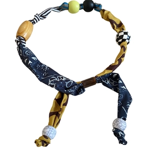 Ethnic paisley and leopard print necklace with handcrafted wooden beads on white backdrop