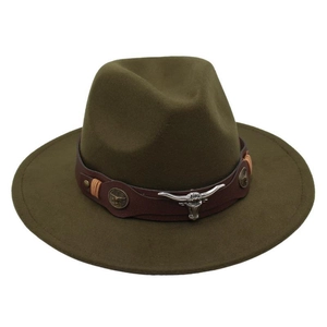 Detail of western fedora hat featuring brown leather band and silver bull skull ornament