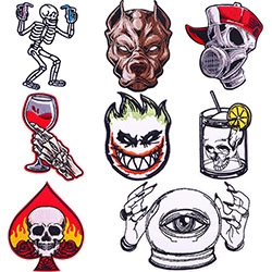 Detail view of punk letter and skull embroidery patches for DIY clothing customization