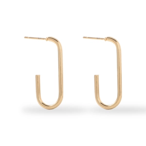 Close-up of golden geometric U-shaped stainless steel earrings with 18K gold finish